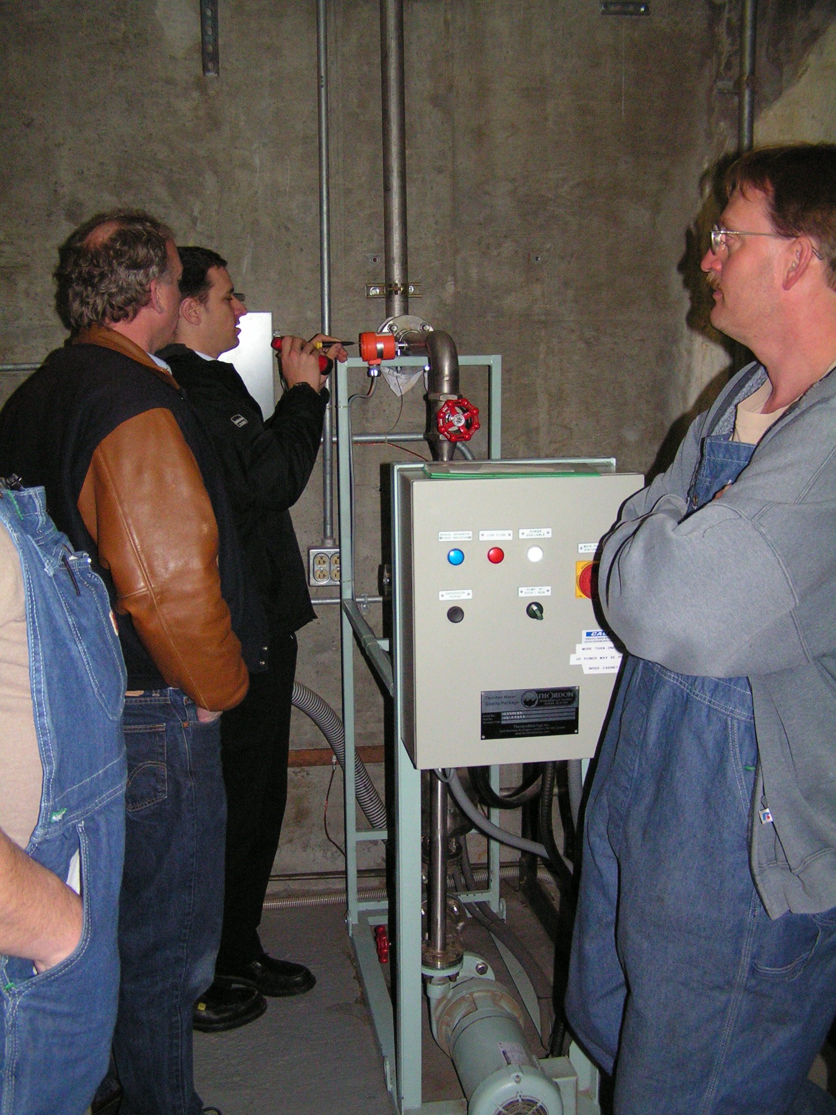 Water Quality Package 1 Todd Terry of Pacific Marine Equipment (brown sleeves) and Scott Groves of Thordon Bearings (black pants) inspect the Thordon Water Quality Package at the 2008 startup.